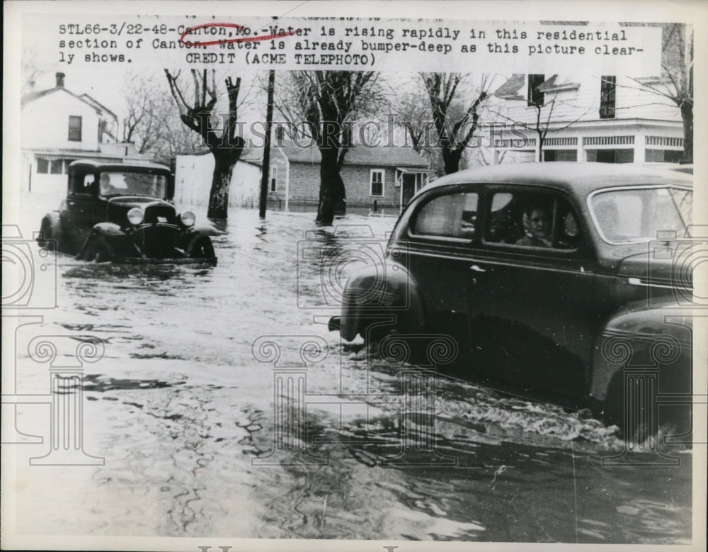 1948 Water is rising rapidly in the residential section of Canton-Historic Images