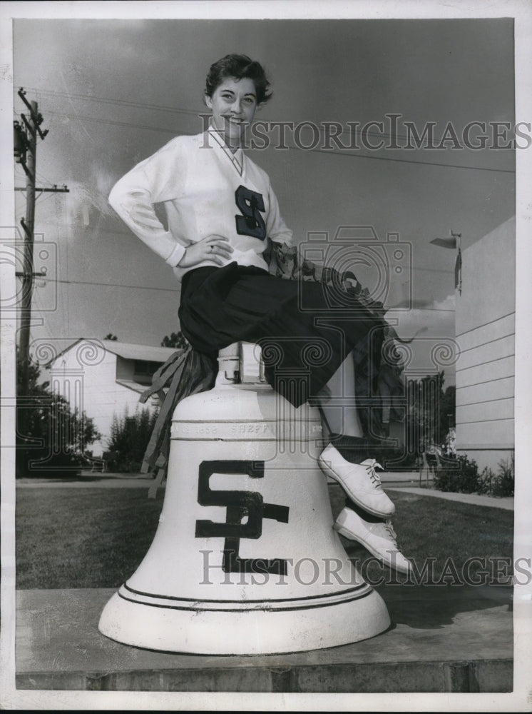 1955 Press Photo Kathy Wilson on top of historic bell in Stockton College campus-Historic Images