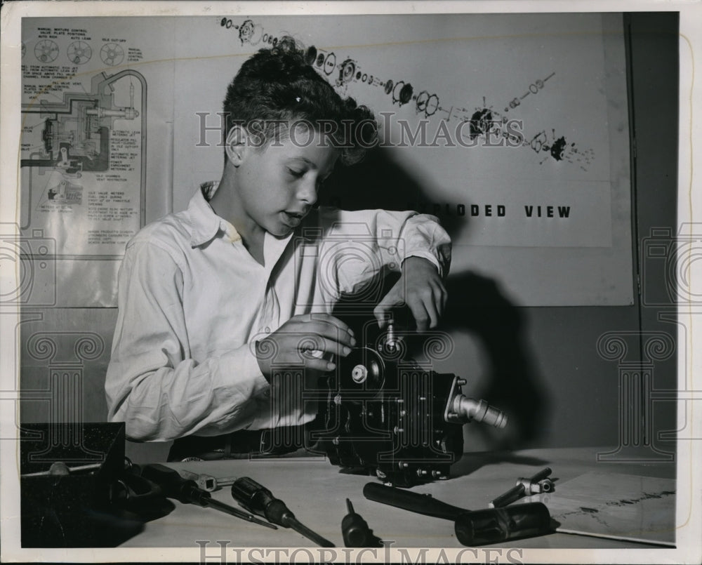 1944 Press Photo Jack Butler making his &quot;guinea pig&quot; - Historic Images