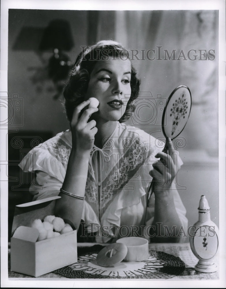 1954 Press Photo Woman uses face powder as part of her skin care needs - Historic Images