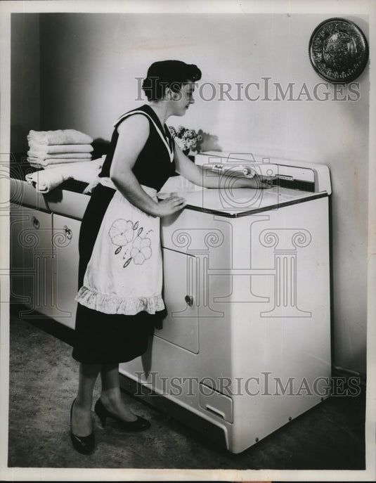 1957 Press Photo Timer Dial and Push Button Function Electric Dryer Demonstrated - Historic Images