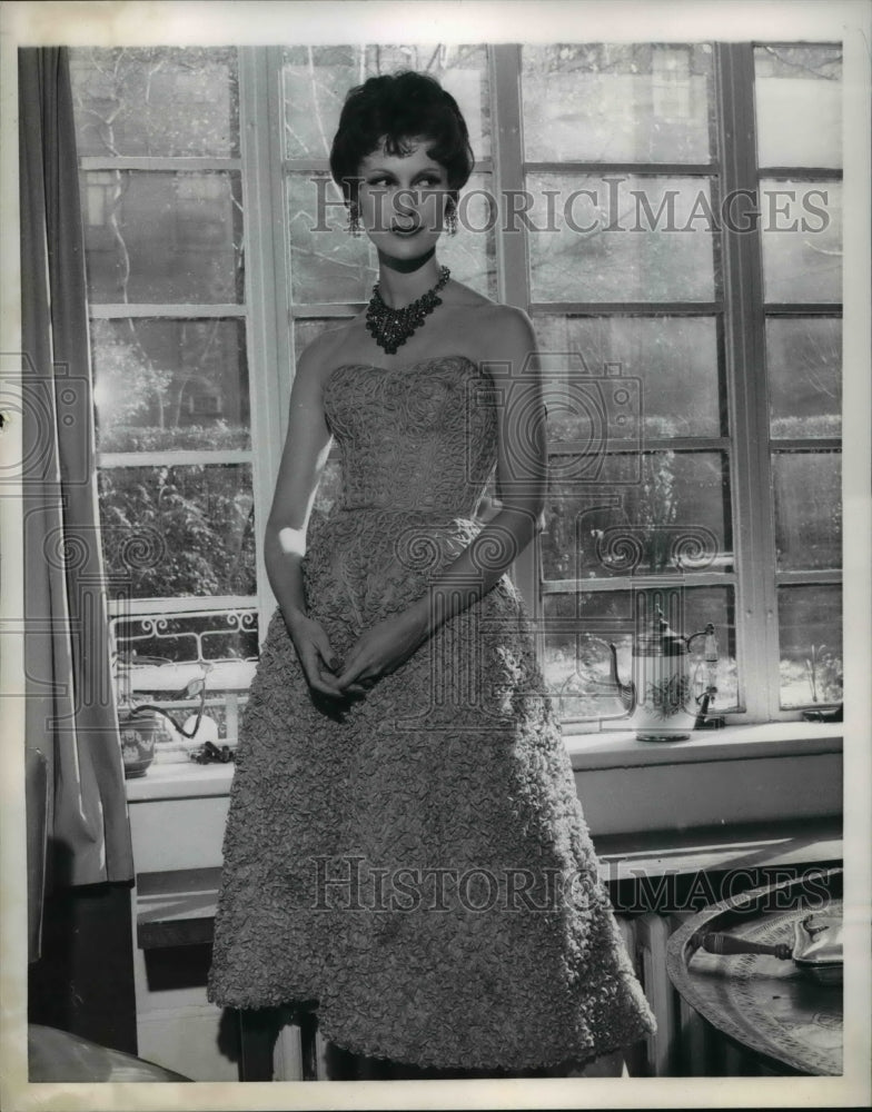 1957 Press Photo Woman wearing a short evening dress for spring - Historic Images