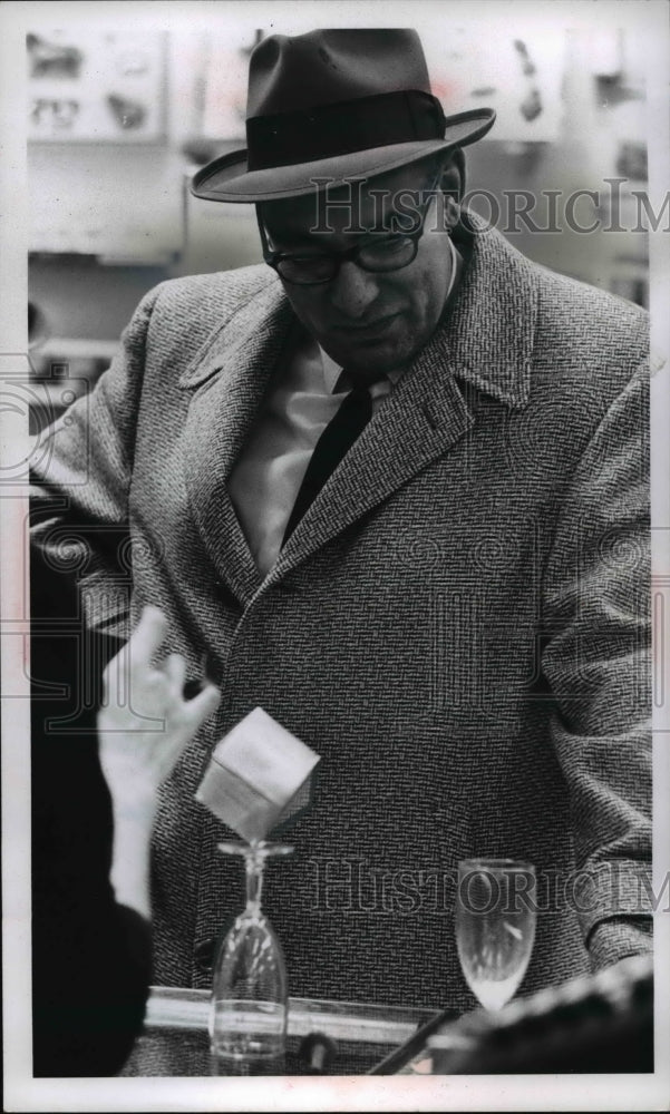 1964 Press Photo Gyroscope in a box balances on a wine glass at the Higbees - Historic Images