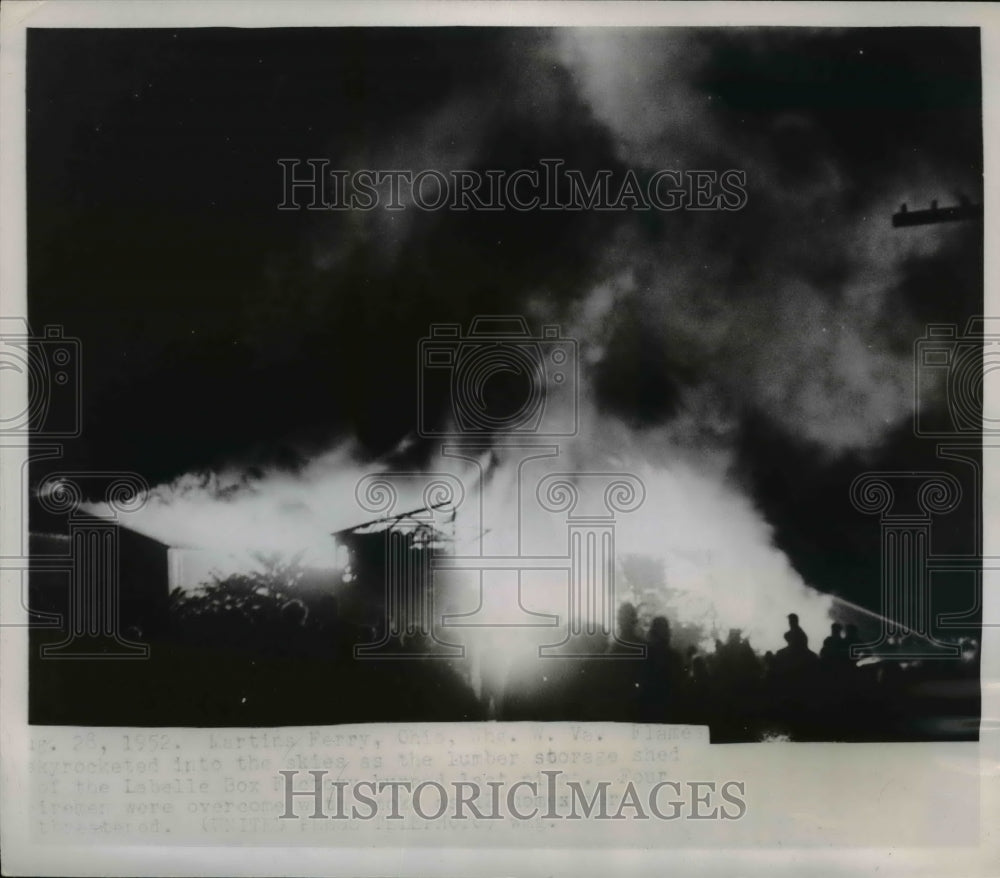 1952 Press Photo Flames skyrocketed into the skies as the lumber storage shed - Historic Images