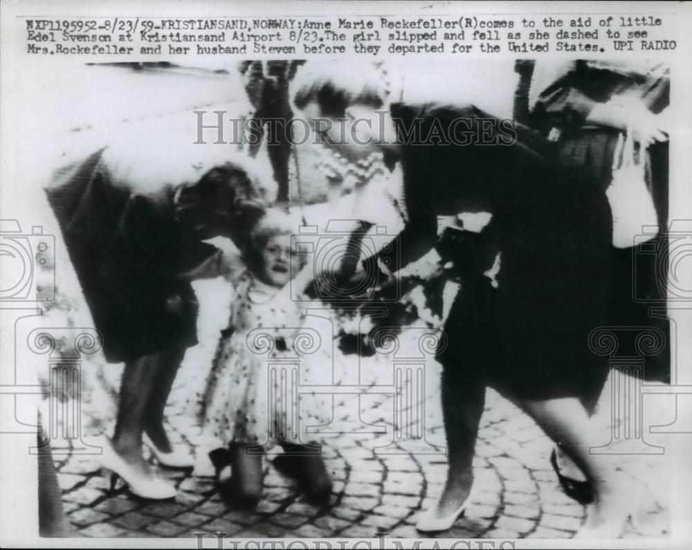 1959 Press Photo Anne Marie Rockefeller, comes to aid of little Edel svenson at - Historic Images