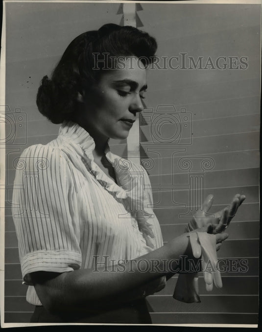 1943 Marvinol's elastic gloves are tried by the Martin laboratory-Historic Images