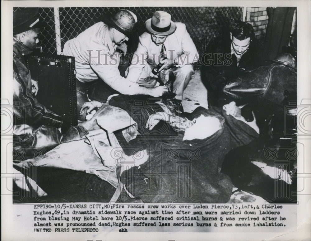 1953 Press Photo Fire Rescue Crew Works over Luden Pierce &amp; Charles Hughes - Historic Images