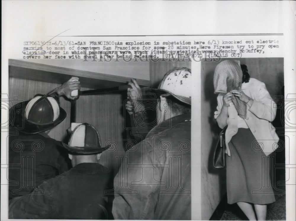 1961 Press Photo Firemen try to pry open elevator at the substation - Historic Images