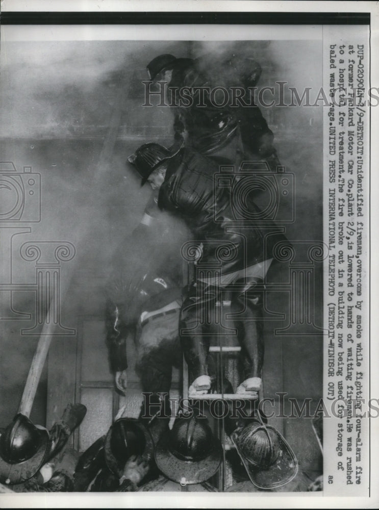 1959 Press Photo Unidentified fireman was overcome by smoke while fire fighting - Historic Images