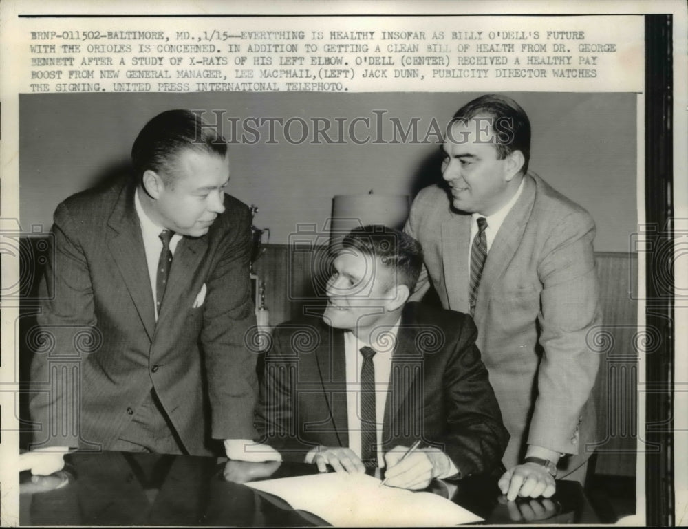 1959 Press Photo Dr. George Bennett studies the x-rays of Billy O&#39;dell - Historic Images