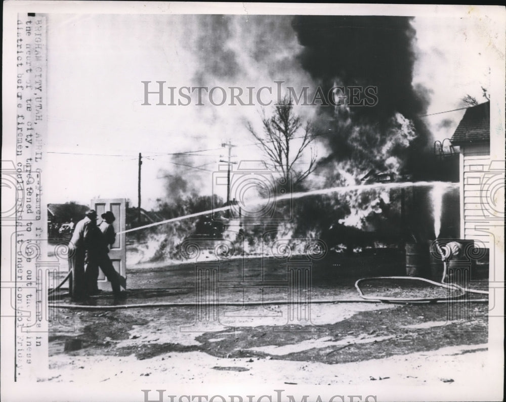 1951 Press Photo Brigham City Utah firemen battle blaze in heart of city - Historic Images