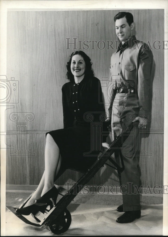 1940 Press Photo Hugh Holler models new overalls while Evelyn Watson sits. - Historic Images