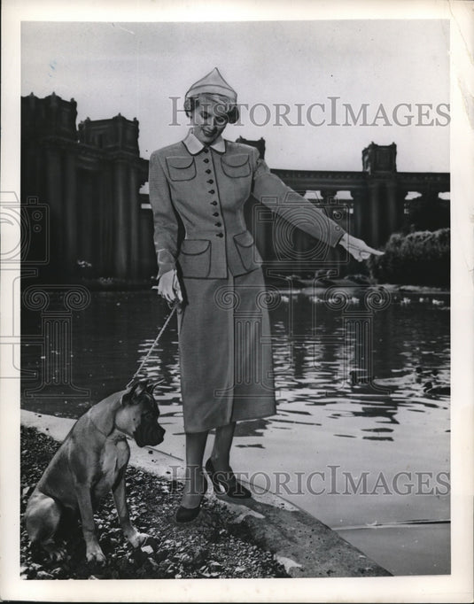 1949 Press Photo Fashion model in coat & skirt for Spring 1950 - Historic Images