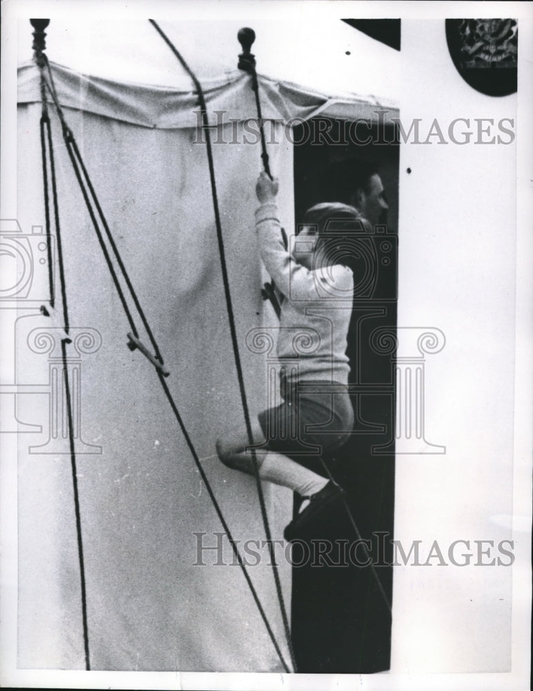 1957 Press Photo Prince Charles Climbing a Rope of a Refreshment Tent - Historic Images