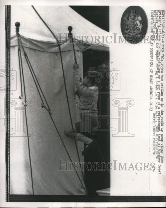 1957 Press Photo Britain's Prince Charles shinning up rope of refreshment tent - Historic Images