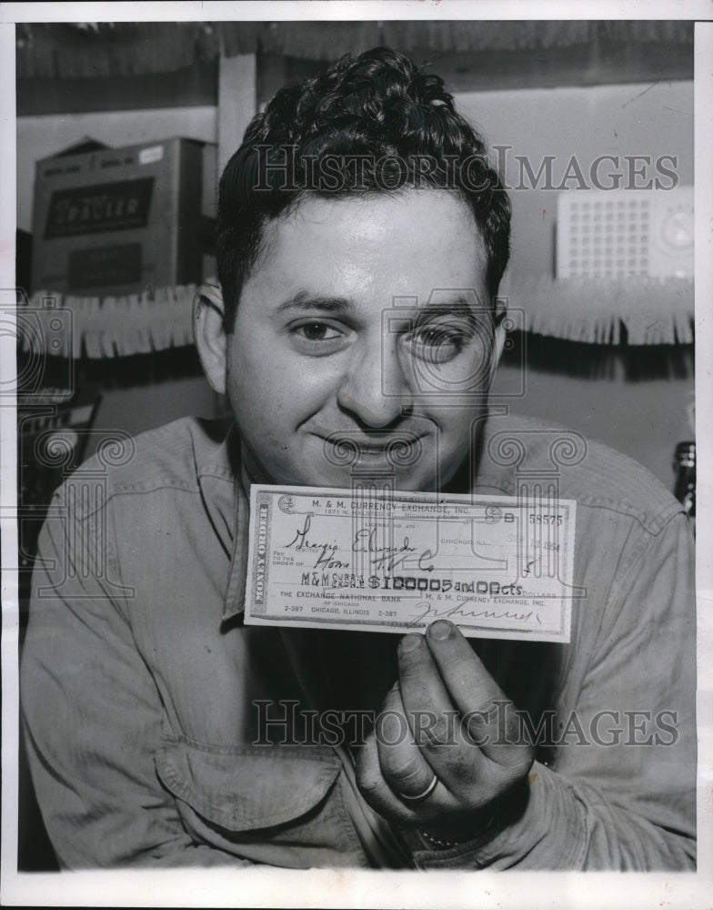 1954 Press Photo Phil Natan Displays Error Check - Historic Images