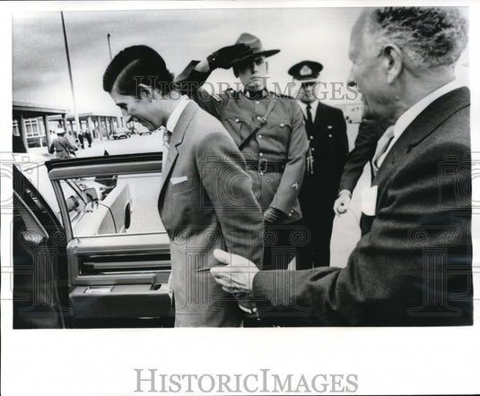 1970 Press Photo Prince Charles escorted to car after arrival at Uplands Airport - Historic Images