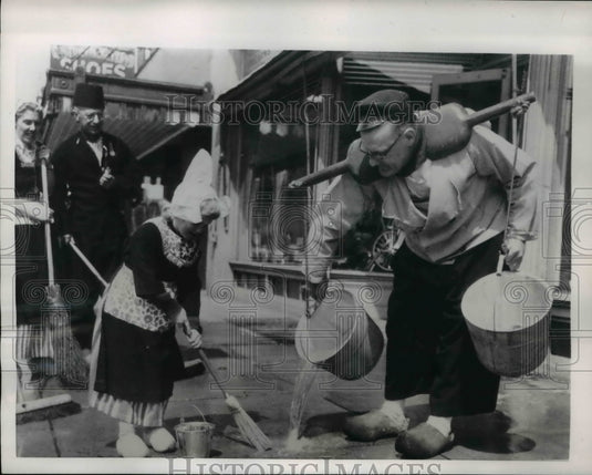 1954 Press Photo 4-Year-Old & Grandfather Cleaning Sidewalk, Tulip Festival - Historic Images