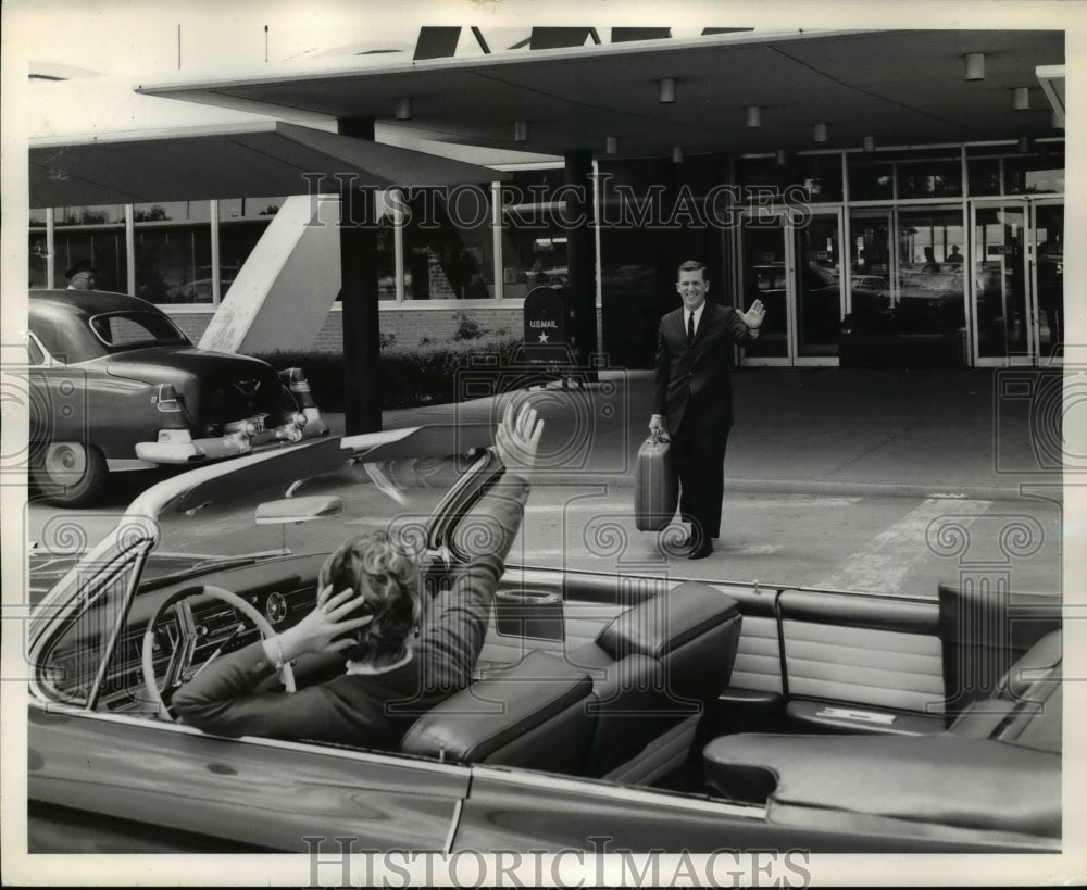 1961 Mrs J.T. Spencer scheduled airport arrival & deplaning husband - Historic Images