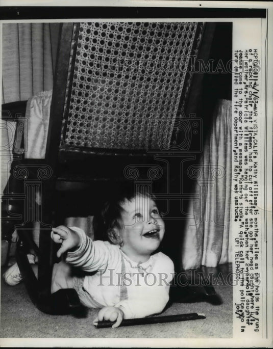 1963 Press Photo Kathy Williams holds rocking chair that she got her head caught - Historic Images