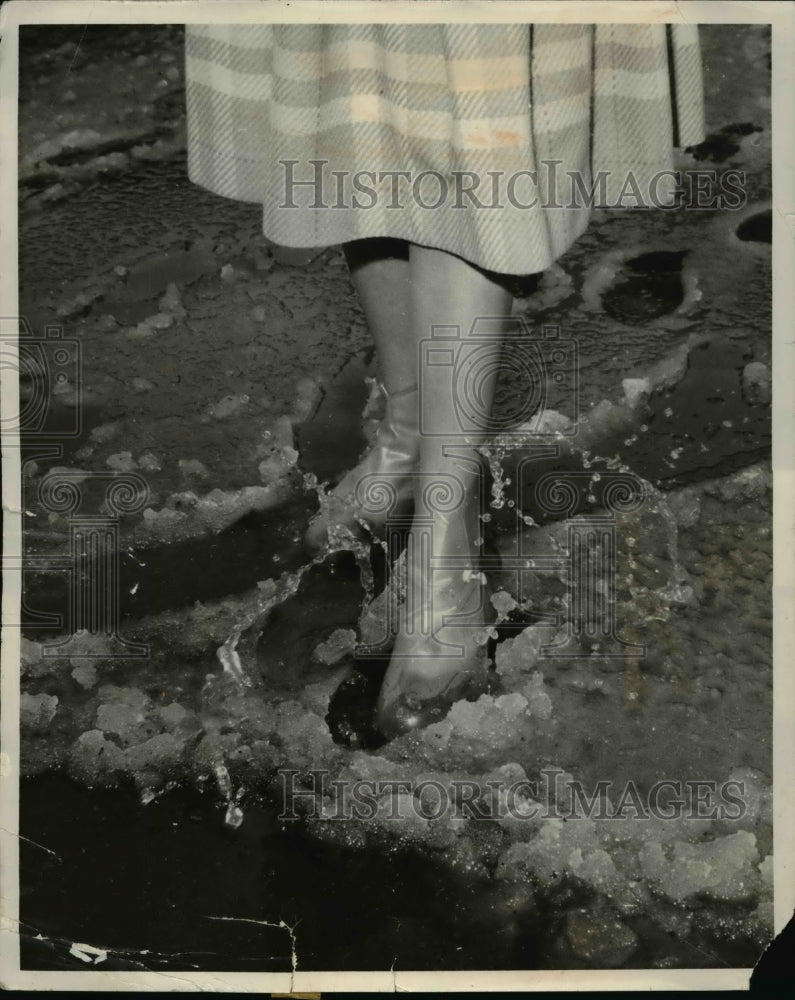 1960 If slush comes, can sunny be far behind? This happened to be-Historic Images