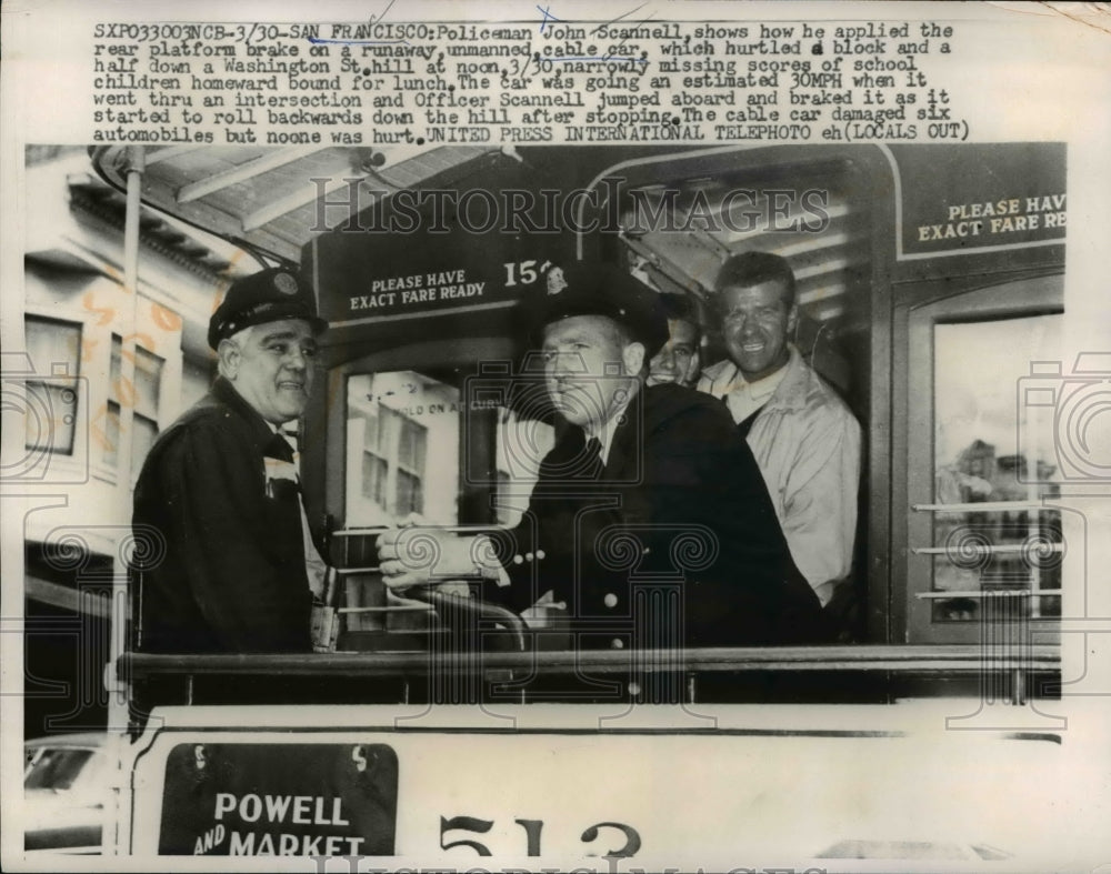 1960 Press Photo John Scannell shows how he applied the rear platform brake - Historic Images