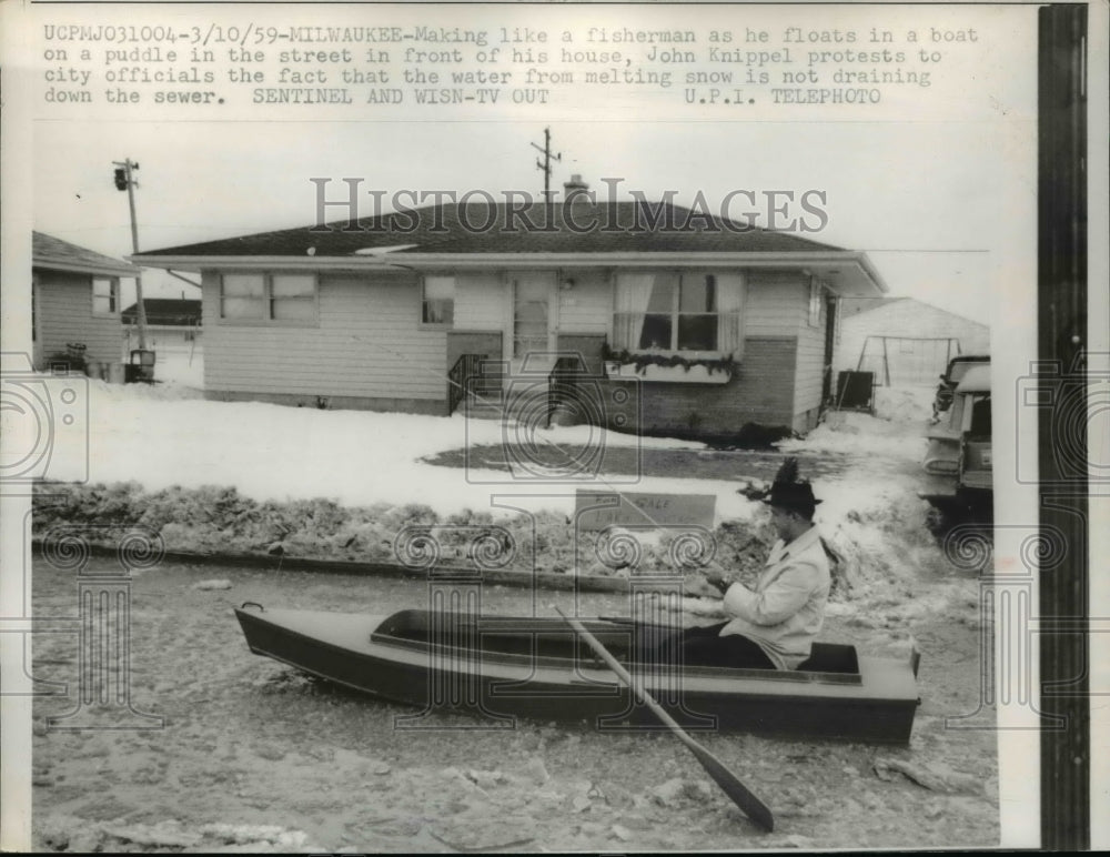 1959 Press Photo John Knippel protesting Melting Water Draining Into Sewer - Historic Images