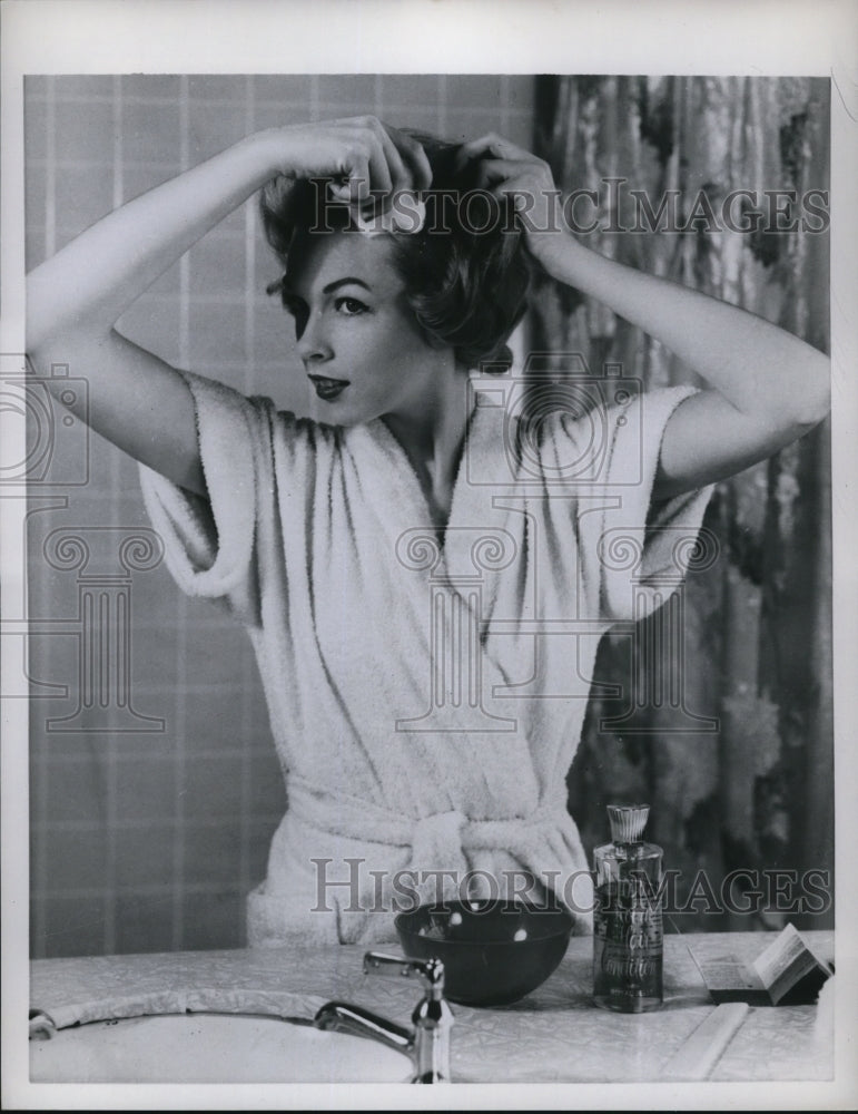 1958 Putting oil in the scalp once in a while will give healthy hair-Historic Images