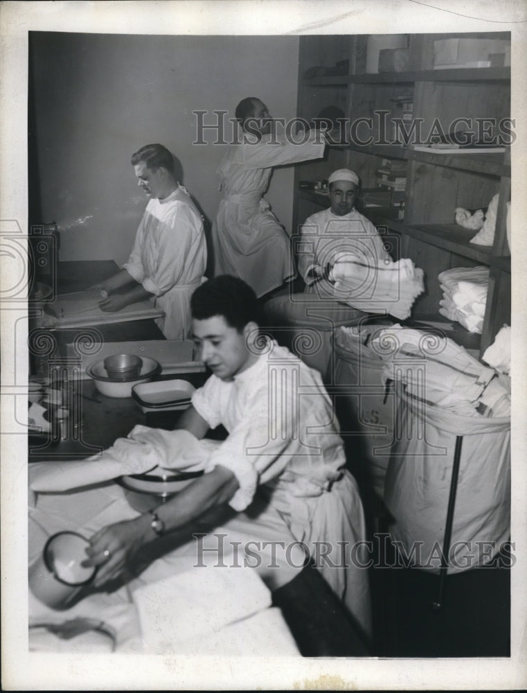 1943 The operating room materials being put together by Peter Venuty-Historic Images