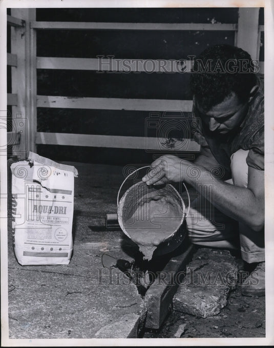 1963 Press Photo Patching masonry & concrete, one of many jobs left for winter - Historic Images