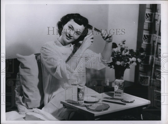 1952 Woman using dry shampoo to clean & brush hair-Historic Images