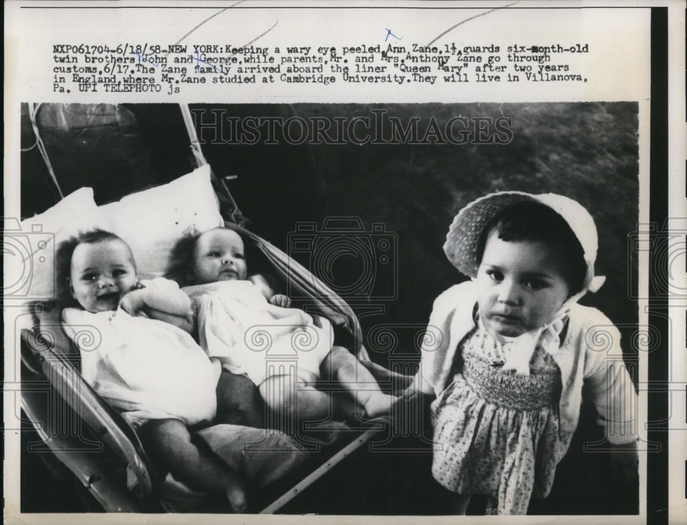 1958 Press Photo New York Ann Zane guards 6 month old twin brothers while - Historic Images