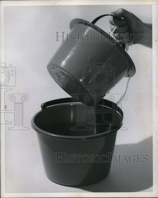 1962 Press Photo The two in one bucket, with lid and strainer - Historic Images
