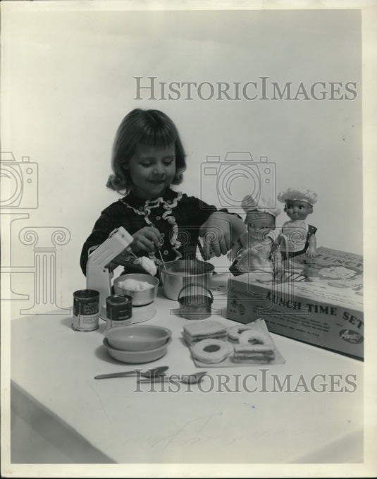 1956 Press Photo Little girl playing with her "Lunch Time Set" Christmas Gift - Historic Images
