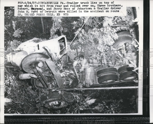 1957 Press Photo Trailer truck lies on top of car which it hit from rear - Historic Images