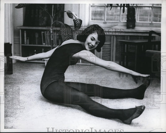 1960 A woman performing an exercise for teen-agers-Historic Images