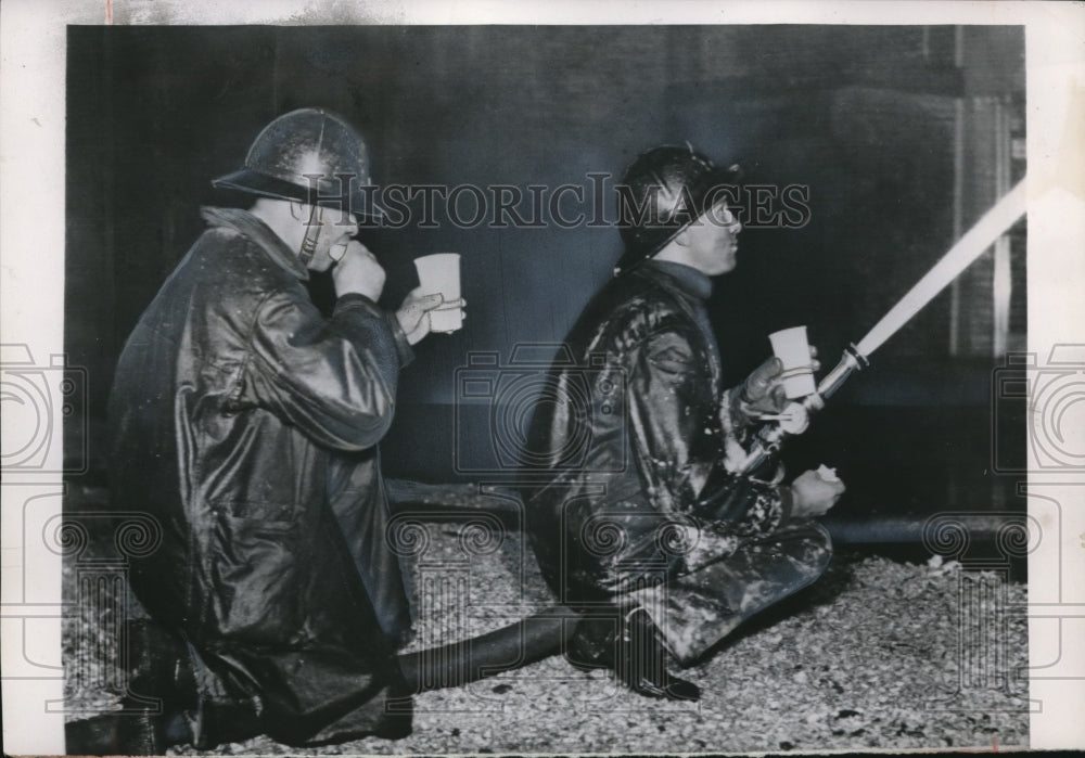 1953 Press Photo Firemen taking a break from a tiring work - Historic Images