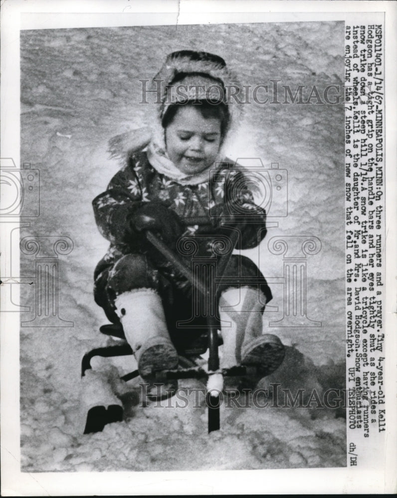 1967 Press Photo 4-Year-Old Kelli Hodgson Riding Snow Tricycle Down Hill Sled - Historic Images