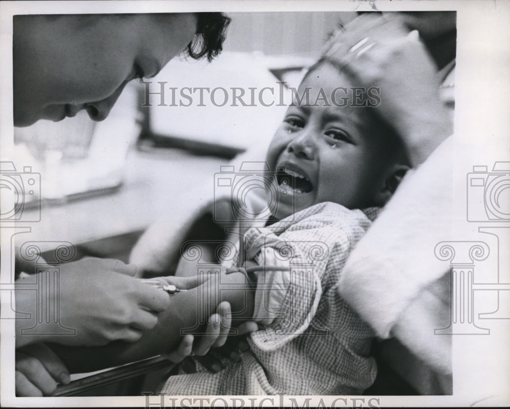 1958 Press Photo Marland Rodriguez getting shot from needle - Historic Images