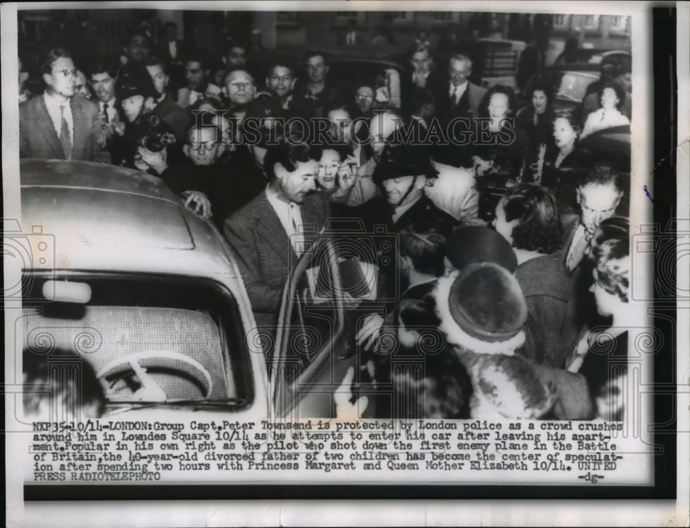 1955 Capt. Peter Townsend Protected by London Police in Crowd - Historic Images