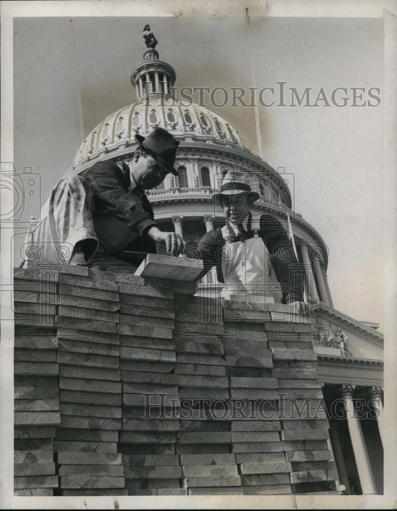 1940 of carpenters on pile of lumber in front of the Capitol-Historic Images