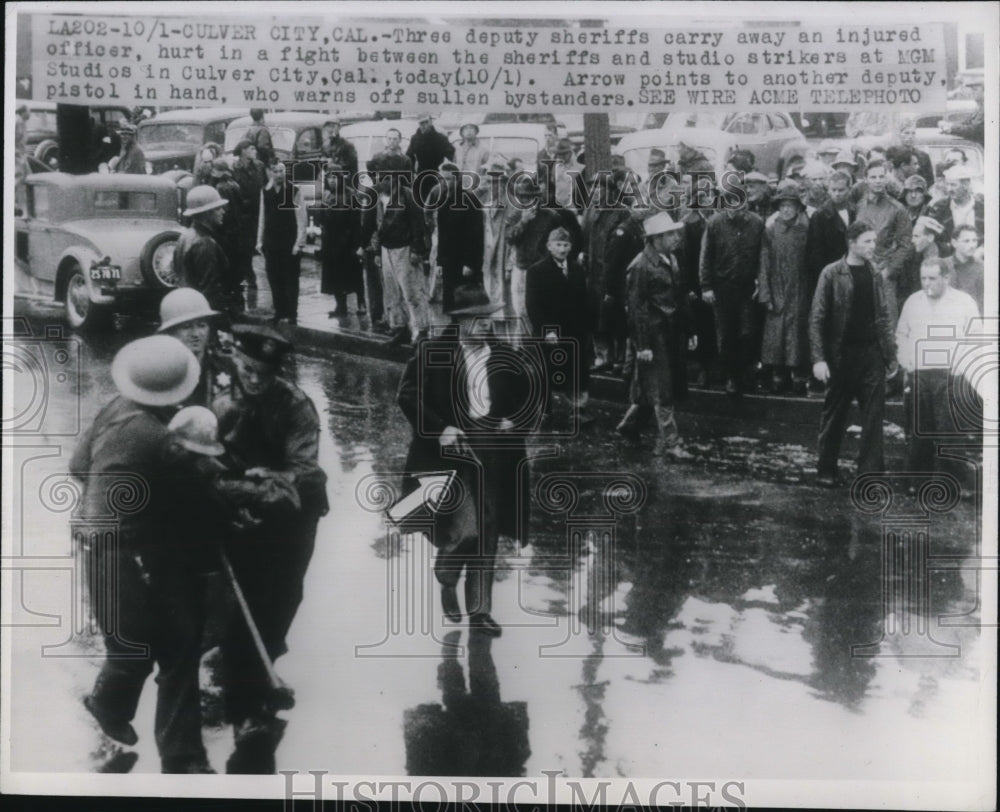 1946 Press Photo Deputy Sheriffs Carrying Injured Officer after Striker Fight - Historic Images