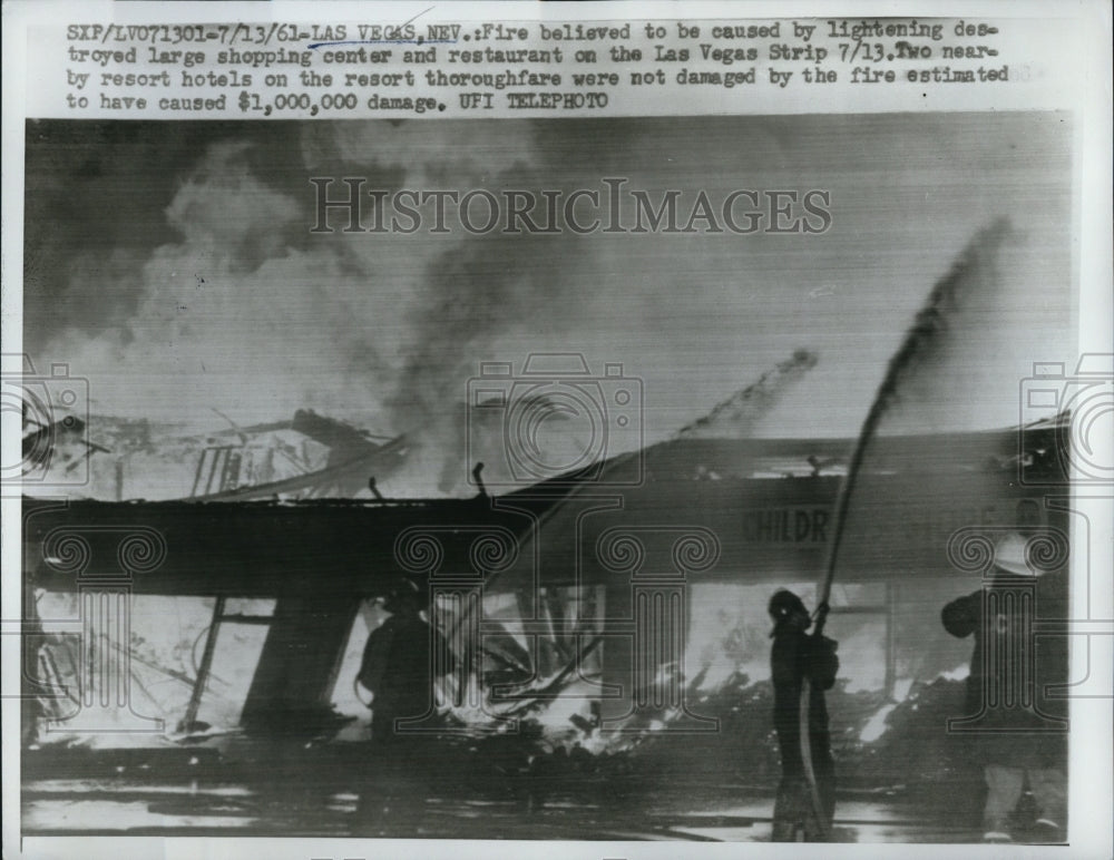 1961 Press Photo of Las Vegas firefighters battling a blaze on the Las Vegas - Historic Images