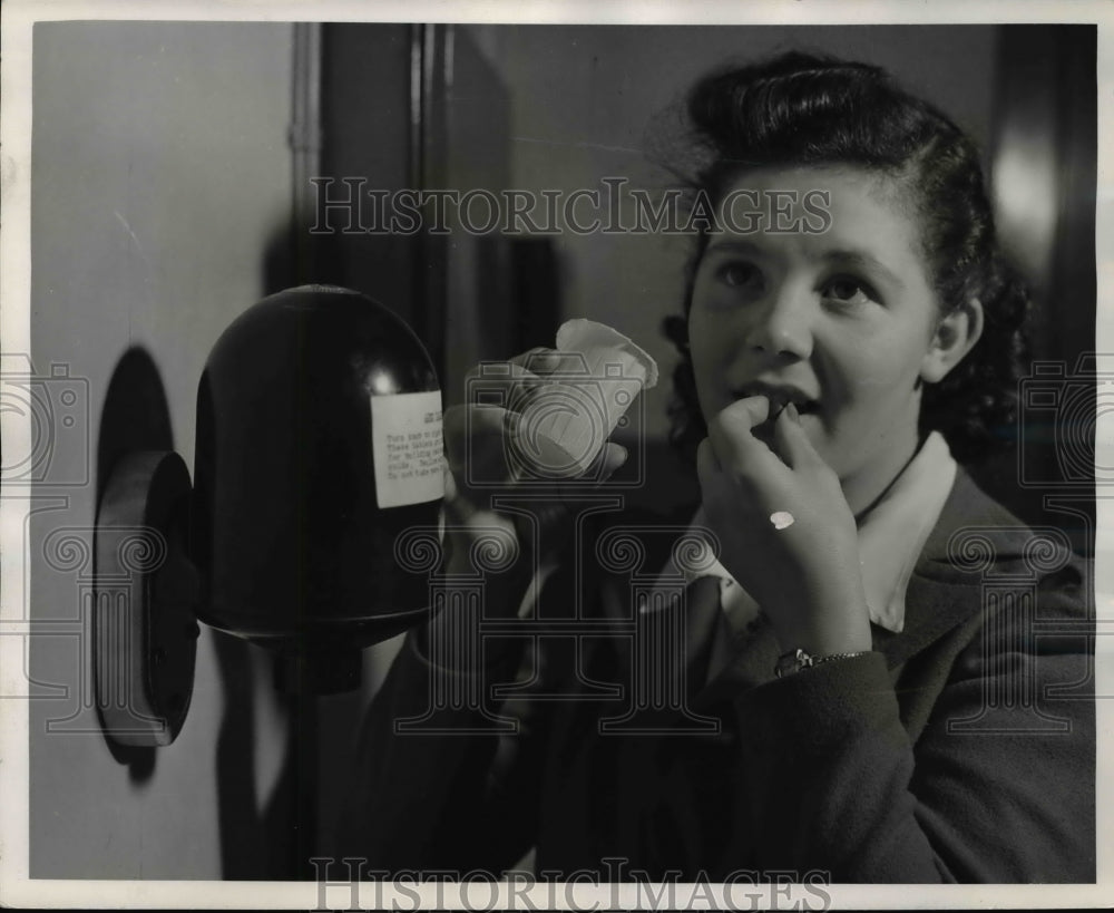 1941 Press Photo of woman taking a vitamin at the Westinghouse Transformer - Historic Images