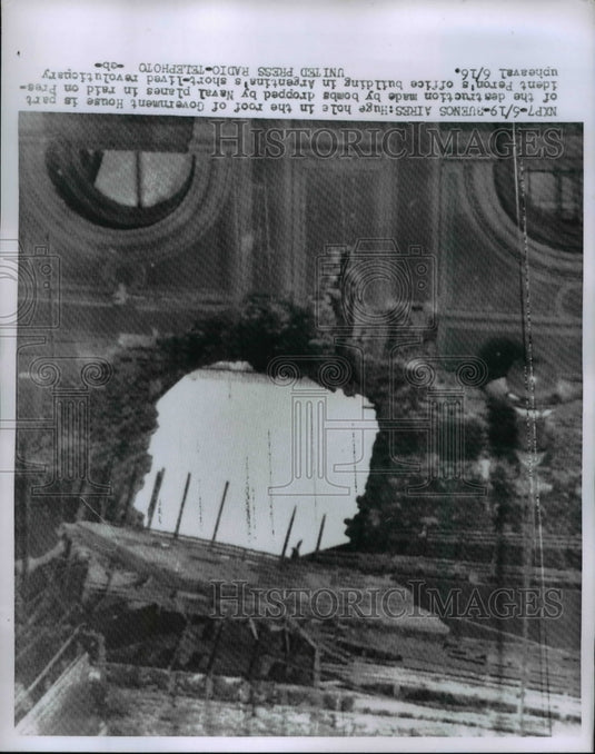 1955 of hole in the roof of the Goverment House that was made by a - Historic Images