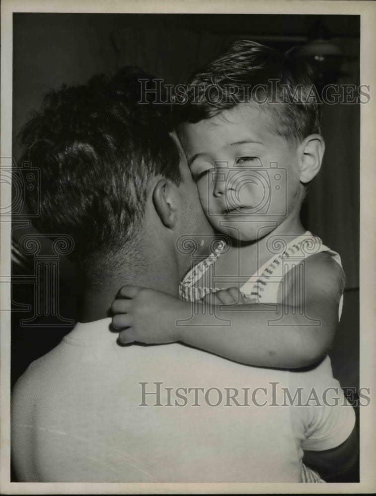 1955 of Gerald Kenner with his son Jerry after he was found. - Historic Images