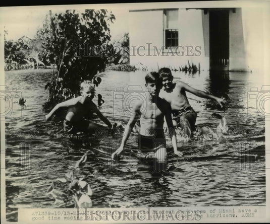 1947 Kids Wading Through Flood Waters After Hurricane in Florida - Historic Images
