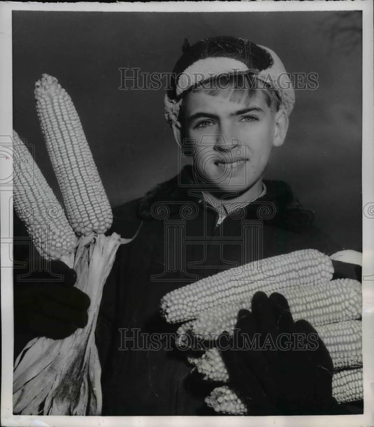 1954 Douglas Weekley holds winning corn Junior Corn Growing Champion - Historic Images