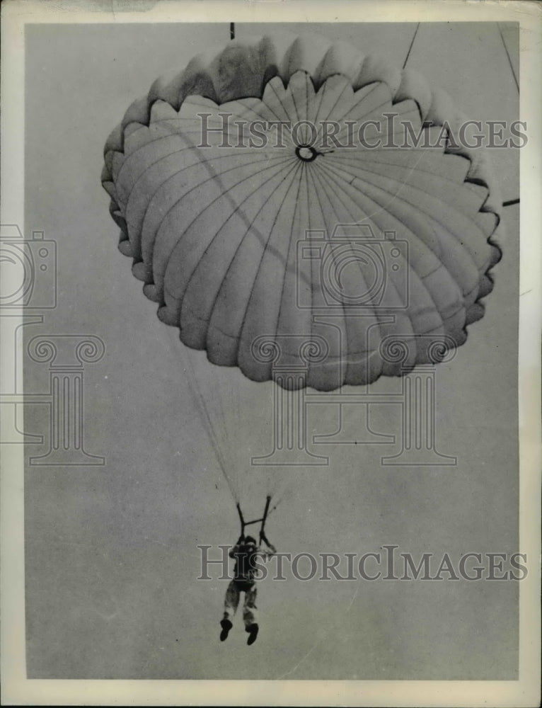 1940 Student parachutist coming down from jumping off tower - Historic Images