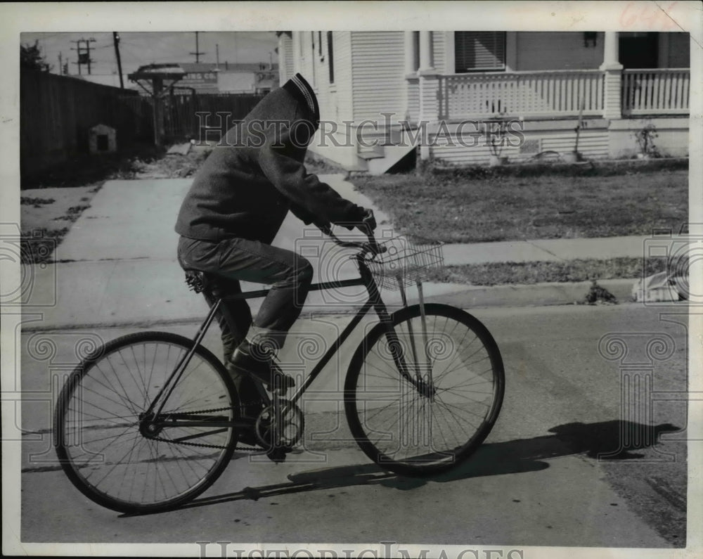 1962 Ten year old Richardson Wun uses his hoodie during biking - Historic Images